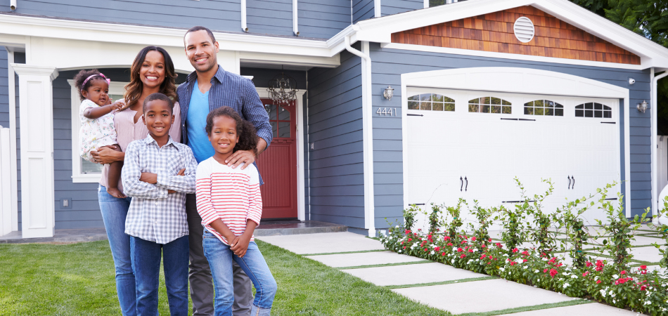  A family standing front of their house